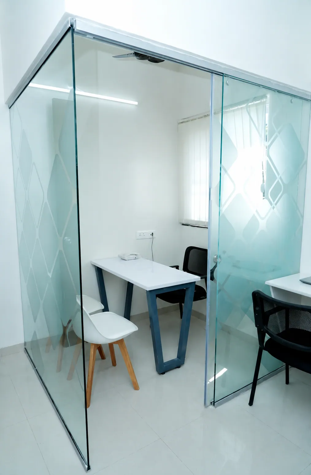 Glass-walled meeting room — RDA Baner office